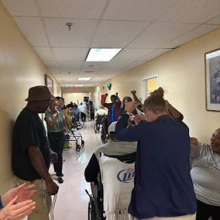 A lively gathering in a healthcare facility, showcasing community spirit and support.