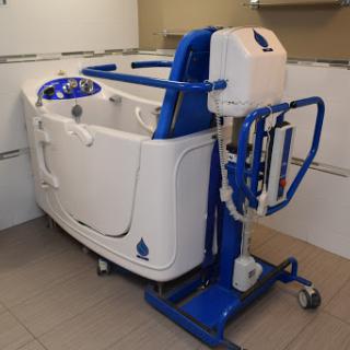 A hydrotherapy bathtub designed for rehabilitation purposes, featuring mobility support.