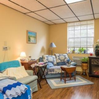 A cozy living room with comfortable furniture, decorative elements, and a warm atmosphere.