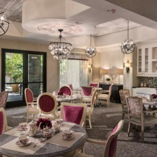 An elegant dining room with luxurious decor and chandeliers.