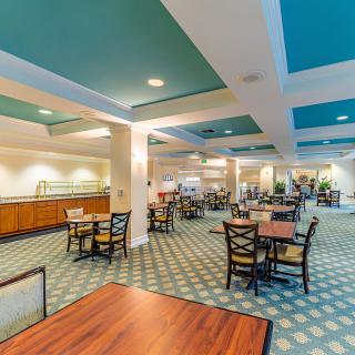 A spacious dining area with modern decor and ample seating.