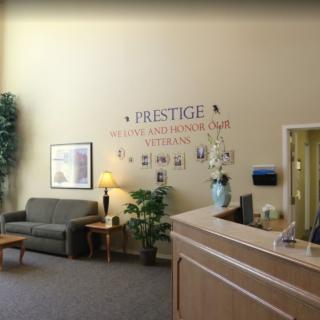 A welcoming office reception area with seating and a decorative vase.