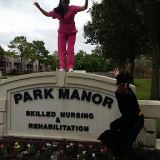 A fun moment captured outside Park Manor, showcasing the playful spirit of two individuals.