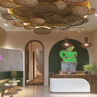 A modern reception area with stylish lighting and green accents.