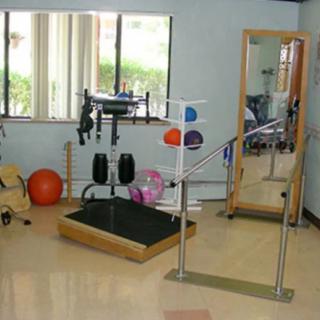 A rehabilitation room equipped with exercise and therapy equipment.
