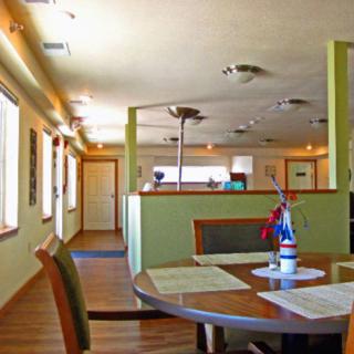 A cozy restaurant interior featuring neatly arranged tables and chairs with simple decor.