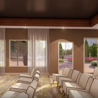 A modern lounge area with comfortable seating and large windows allowing natural light.