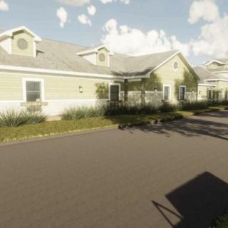 A residential house with well-maintained landscaping and a long driveway.