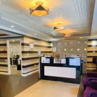 A modern reception area with stylish decor and a welcoming desk.