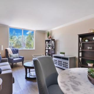 A modern and cozy living room with natural light and stylish furniture.