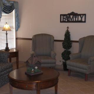 A cozy living room setup with comfortable seating and a warm ambiance.