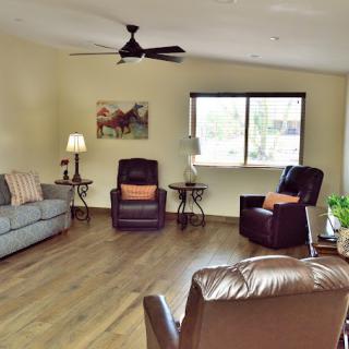 A cozy living room with comfortable seating and a warm, inviting atmosphere.