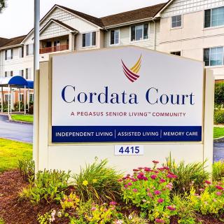 Cordata Court Senior Living Community sign in front of the building.