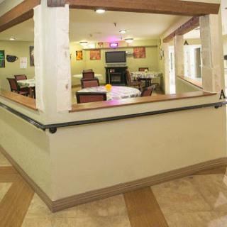 A welcoming common area in a residential facility, featuring comfortable seating and a cozy atmosphere.