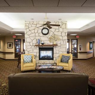 A cozy living room with a fireplace and comfortable seating.