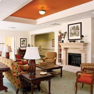 A cozy living room with comfortable seating and a fireplace.