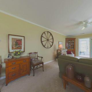 A cozy living room with elegant furniture and decorative art.