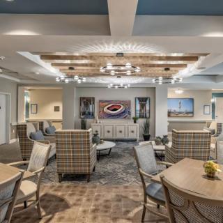 A modern lounge area with comfortable seating and elegant lighting fixtures.