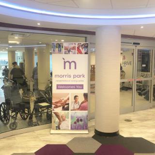 Entrance to a health facility with a rehabilitation focus, featuring a prominent banner.