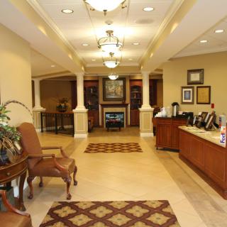 A welcoming lobby with a reception desk and comfortable seating.