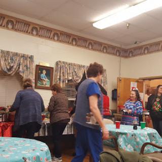 A group of people enjoying a gathering in a cozy indoor setting.