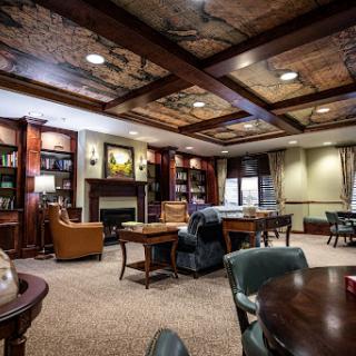 A warm and inviting lounge space featuring elegant furnishings and a cozy atmosphere.