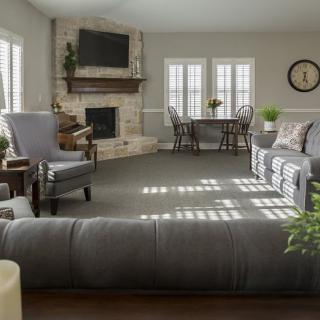 A spacious living room with elegant furniture and a cozy fireplace.
