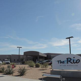 A modern building with a sign reading 'The Rio.'