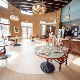 A beautifully designed cafe featuring modern furnishings and warm lighting.