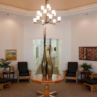 A well-decorated lobby with elegant lighting and seating arrangements.