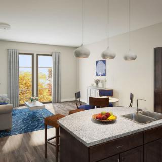 A modern open-plan apartment featuring a kitchen island, dining area, and cozy living space with large windows.