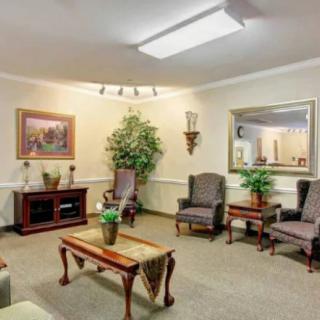 A cozy living room with comfortable seating and elegant decor.