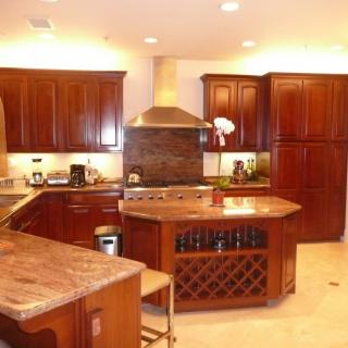Modern kitchen with wooden cabinets and a center island.