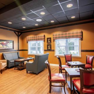 A cozy restaurant interior with elegant seating arrangements and warm lighting.