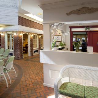 A welcoming hotel lobby with a reception desk and cozy seating area.