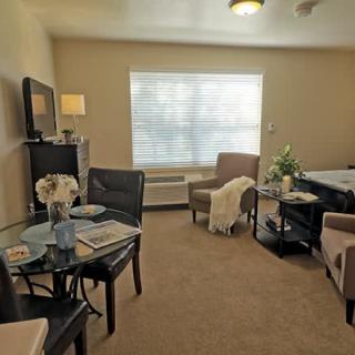 A cozy living room with comfortable seating and soft lighting.