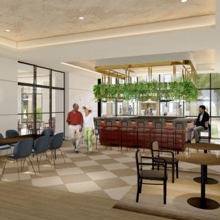 A modern cafe interior with a stylish bar and seating area, complemented by hanging plants and soft lighting.