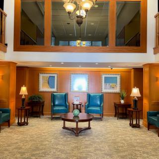 A well-lit lobby area featuring elegant seating arrangements and tasteful decor.