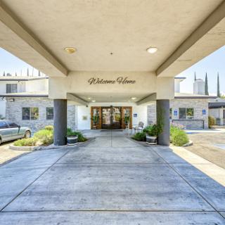 Entrance view of a commercial building with clear signage.