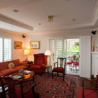 A traditional living room with cozy seating and tasteful decor.