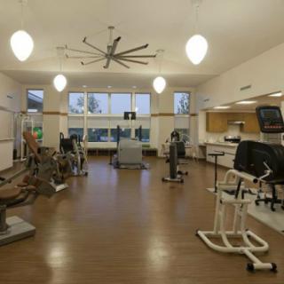A spacious gym filled with various fitness equipment for exercise.