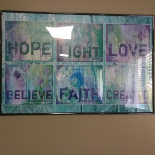 A colorful artwork featuring inspirational words that evoke feelings of hope, light, love, and creativity.