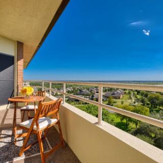 A serene balcony with a stunning view, perfect for enjoying the outdoors.