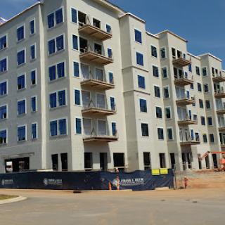 A newly constructed apartment building nearing completion.