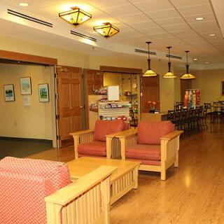 A cozy lobby area with seating and warm lighting.