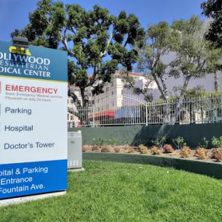Signage at a medical center indicating emergency and hospital services.