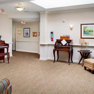 A well-decorated lobby area featuring elegant furniture and artwork.