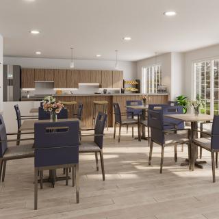 A modern dining room with a view of the kitchen, featuring sleek tables and chairs, ample natural light, and wooden flooring.