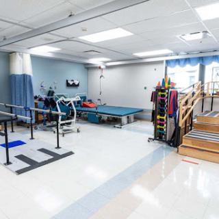 A well-equipped physical therapy room designed for rehabilitation and patient exercises.