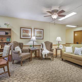 A cozy living room with comfortable furniture and warm lighting.